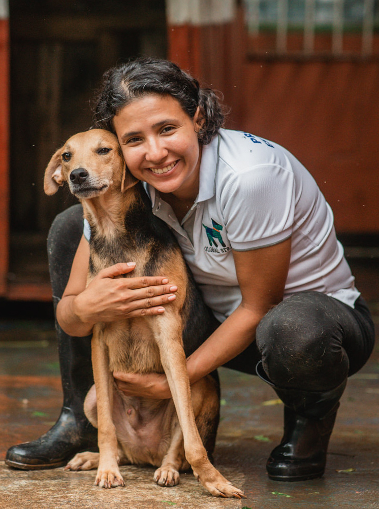 Global Strays Programs Manager of Nicaragua, Elisa Quiroz holding a dog.