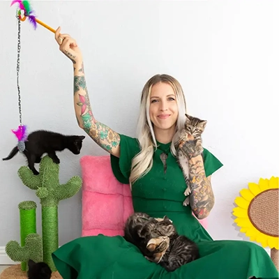 Hannah Shaw, founder of Orphan Kitten Club, with her cats.