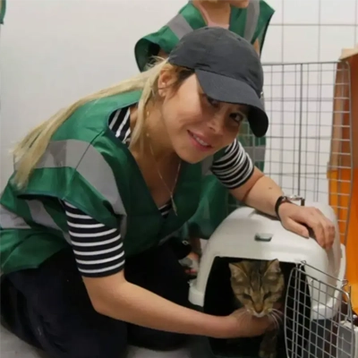 Rawaa Kilani, founder of CatConnect, holding a cat.