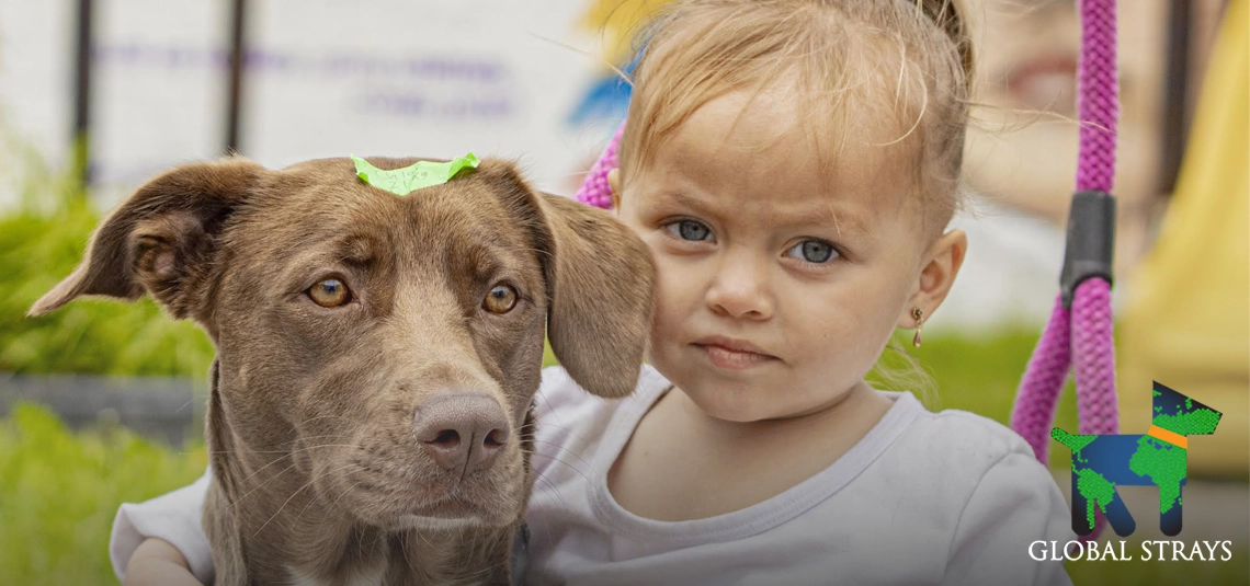 Little girl and her dog at Global Stray's spay/neuter clinic in Colombia.