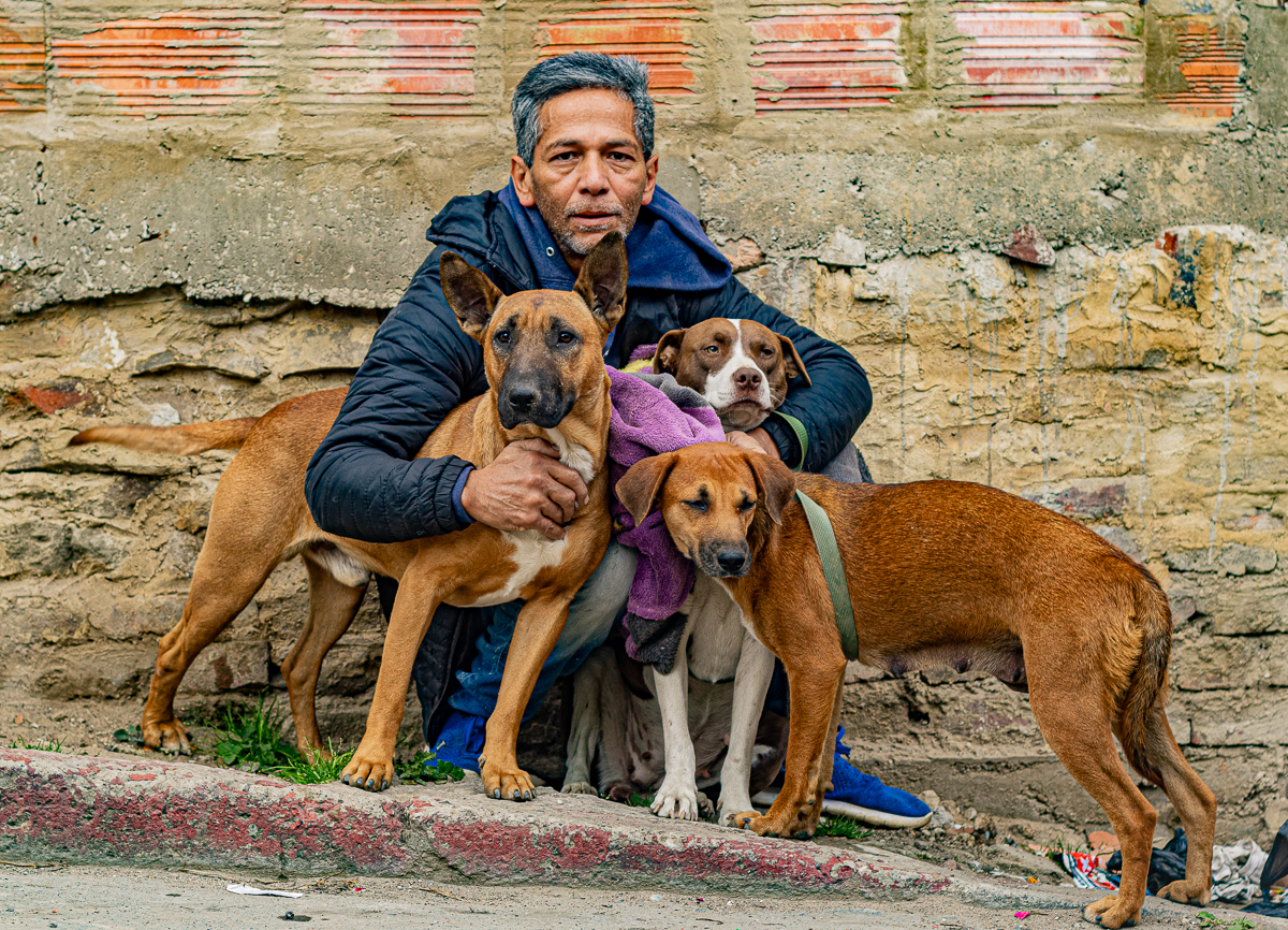 Diego is waiting for his turn to get his pets (three dogs) spayed and neutered. .